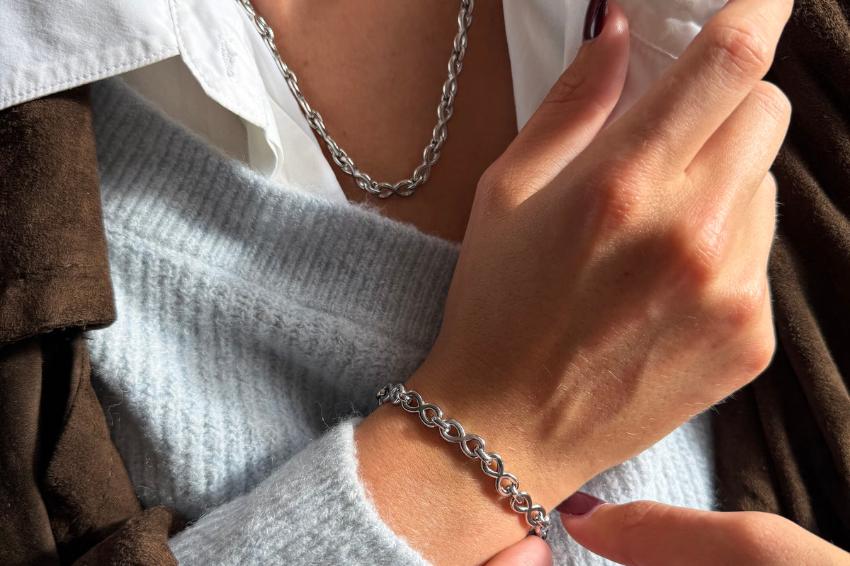 Octave silver infinity link bracelet by Boho Betty – styled with other jewellery, a stackable silver infinity link bracelet
