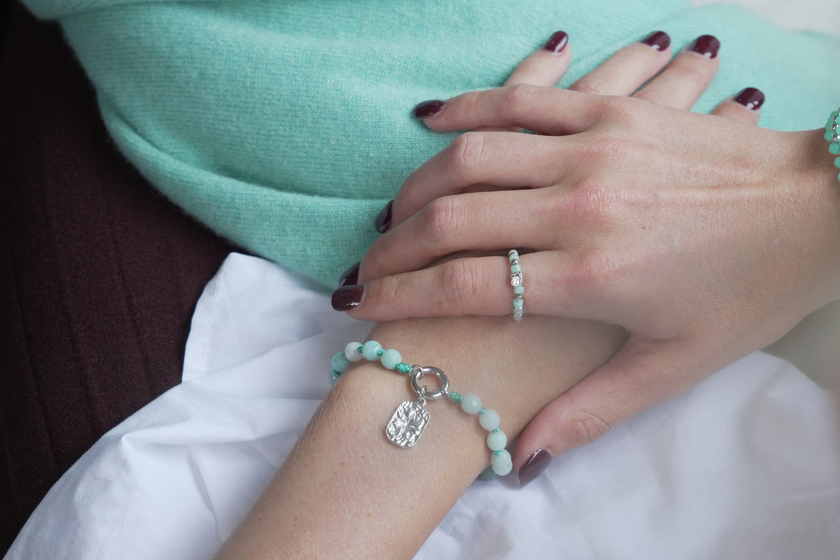 Mala amazonite silver ring by Boho Betty – styled with other jewellery, a silver amazonite beaded stretch ring