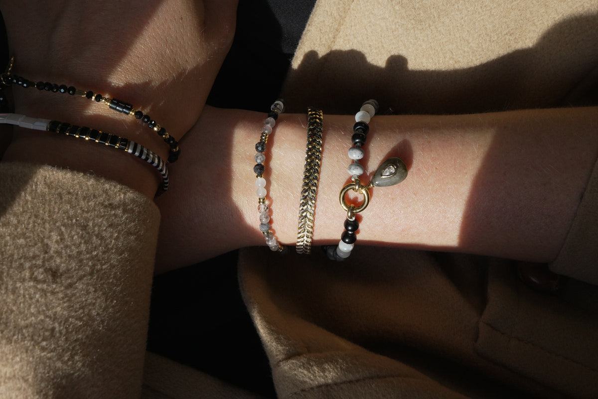 Wonder gold and black rutilated quartz bracelet by Boho Betty – a gold black rutilated quartz beaded stretch bracelet