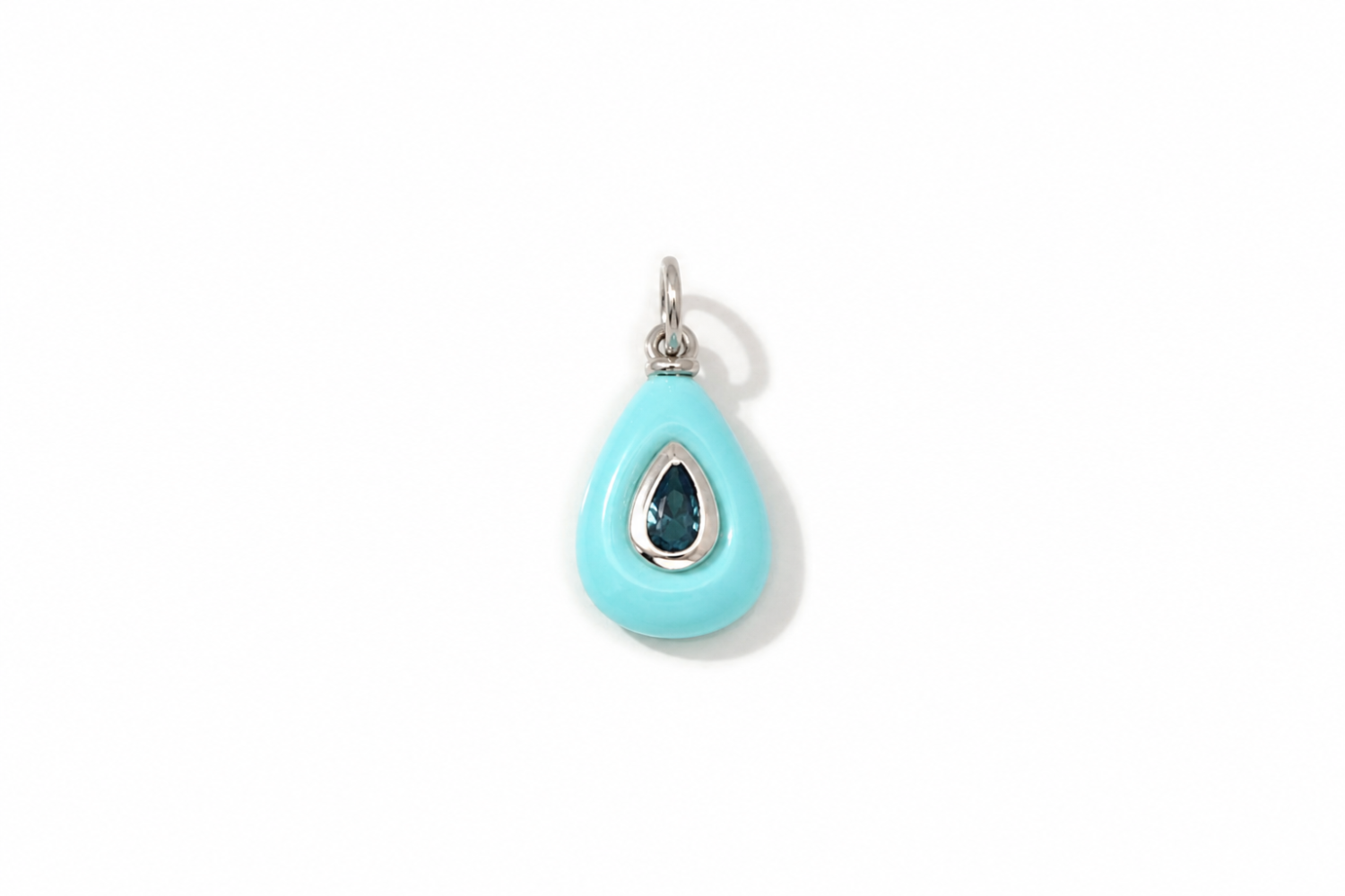 Fleurette Turquoise Charm Silver featuring a carved turquoise-coloured gemstone with a blue crystal on a waterproof rhodium-plated stainless steel loop.