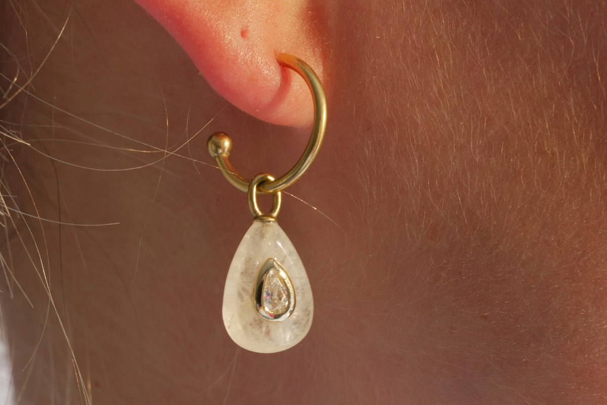 Hana Clear Quartz Gold Hoop Earrings worn with natural clear quartz gemstone drops and waterproof 14k gold PVD hoops for effortless everyday styling.
