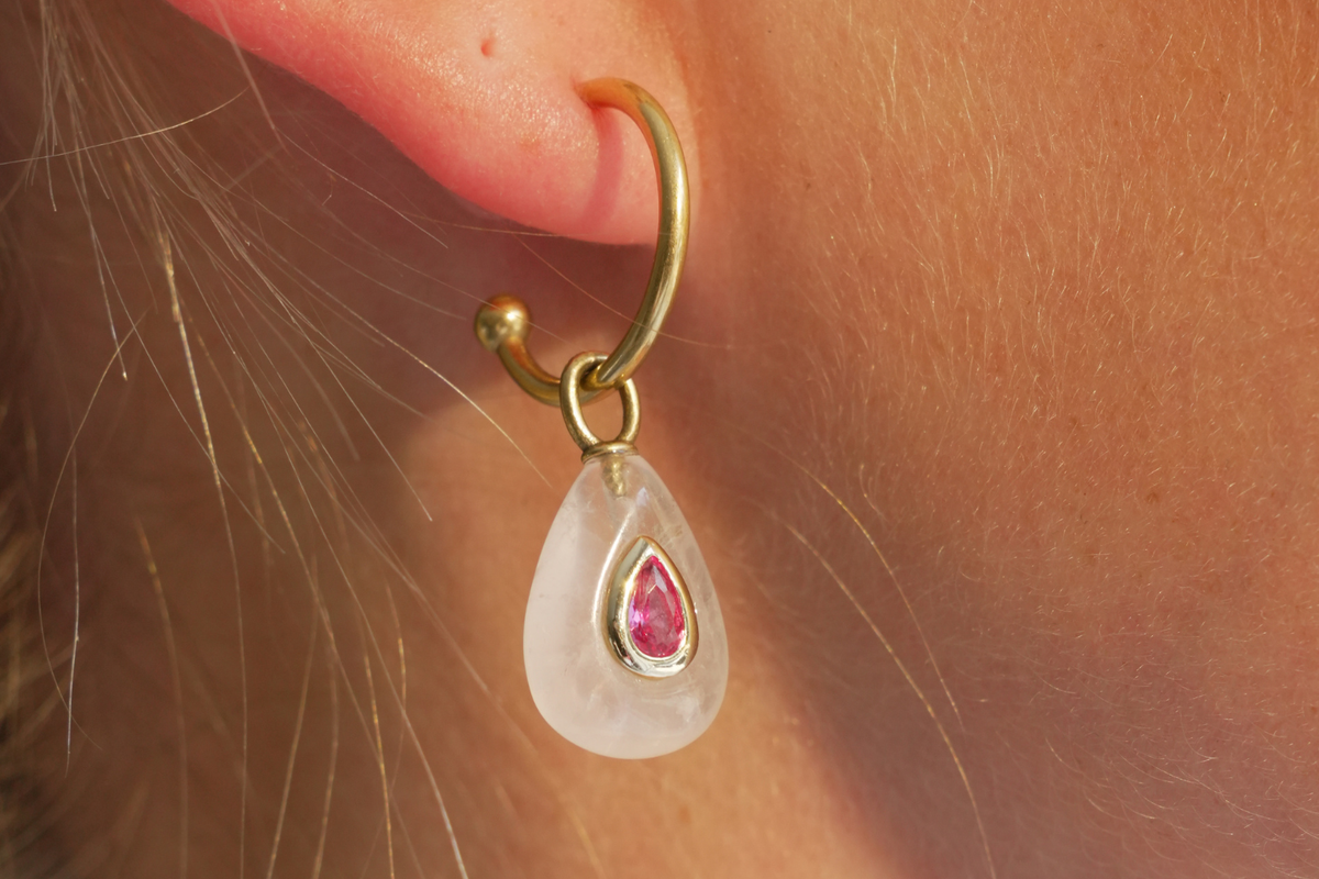Hana Rose Quartz Gold Hoop Earrings worn with Rose Quartz gemstone drops and ruby-coloured crystal details on waterproof 14k gold PVD hoops for effortless holiday styling.