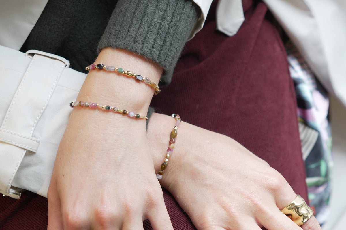 Aya tourmaline gold gemstone bracelet by Boho Betty – styled in a stack, a gold tourmaline gemstone beaded slider bracelet