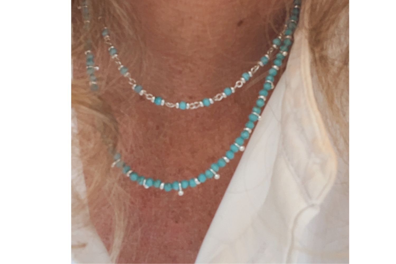 lifestyle shot showcasing Panacea Turquoise silver panacea as the perfect layering necklace with the salus gemstone necklace. Summer Boho Chic