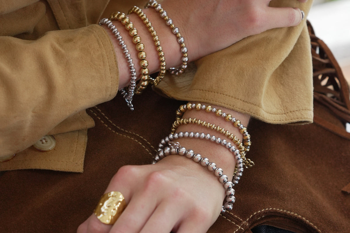 Cleo gold bead stretch bracelet by Boho Betty – styled in a stack, a stackable gold beaded stretch bracelet for everyday wear