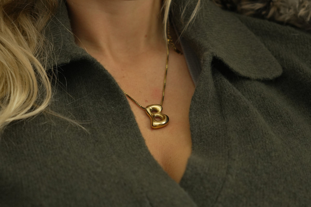 Sola waterproof gold initial letter B necklace by Boho Betty – a gold bubble letter B initial necklace on a fine box chain