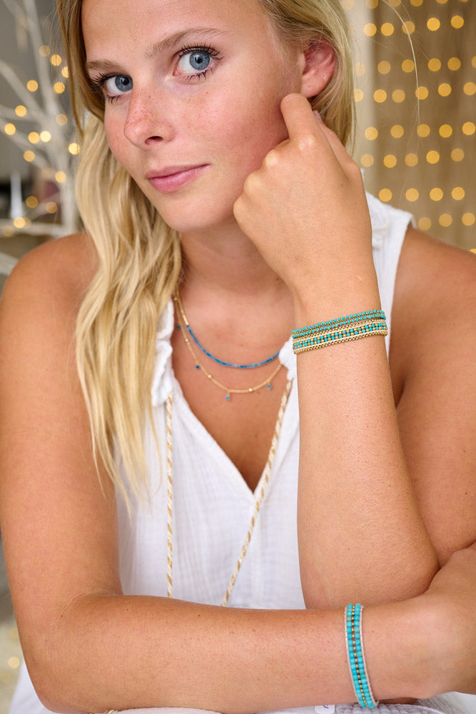 Stack from winter into the summer with the Talia, Isla and Lana in Turquoise paired with the Lily Necklace in Apaatite.