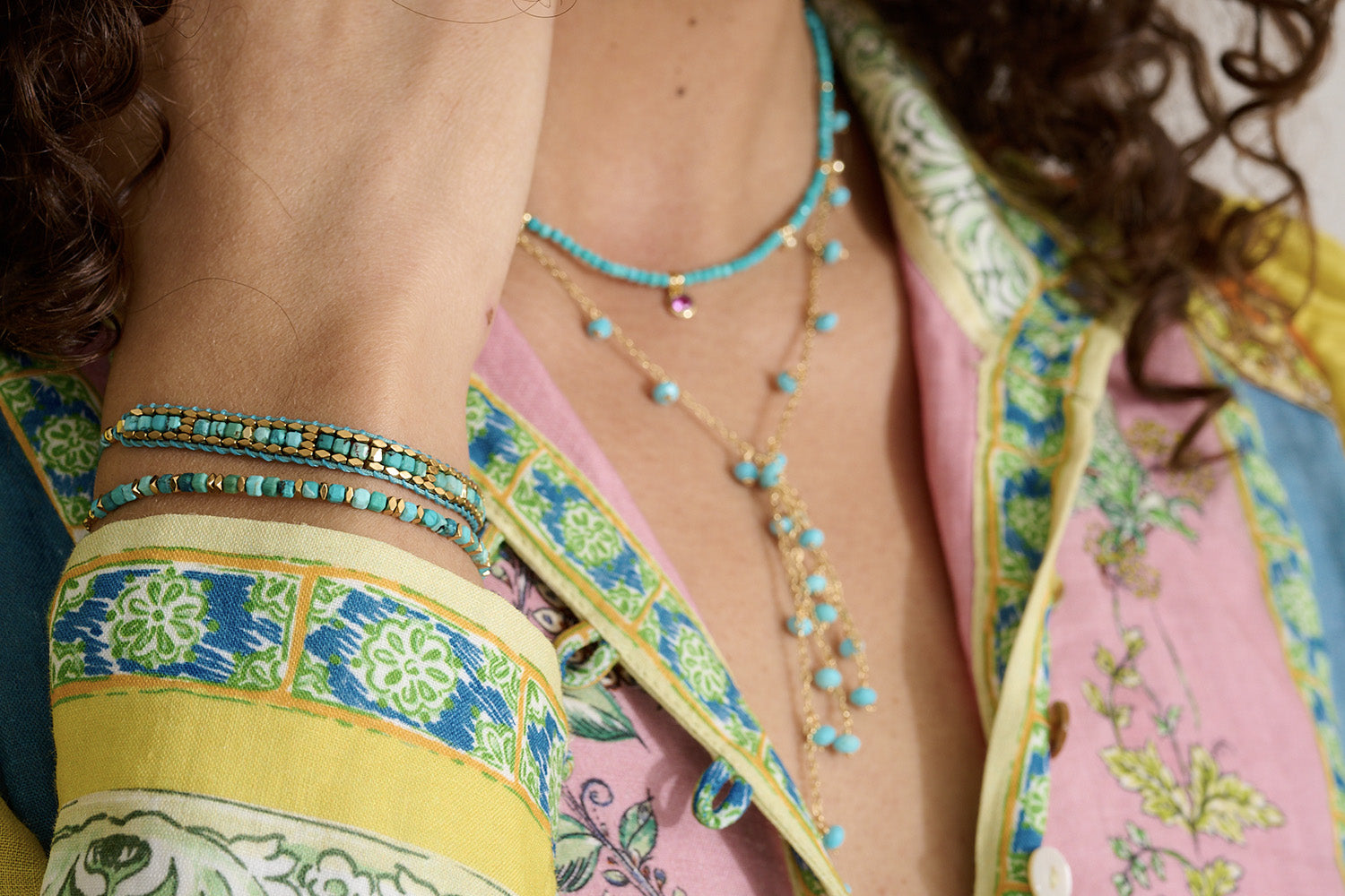 The perfect new accessory to adorn any outfit with the warming turquoise and gold hues.