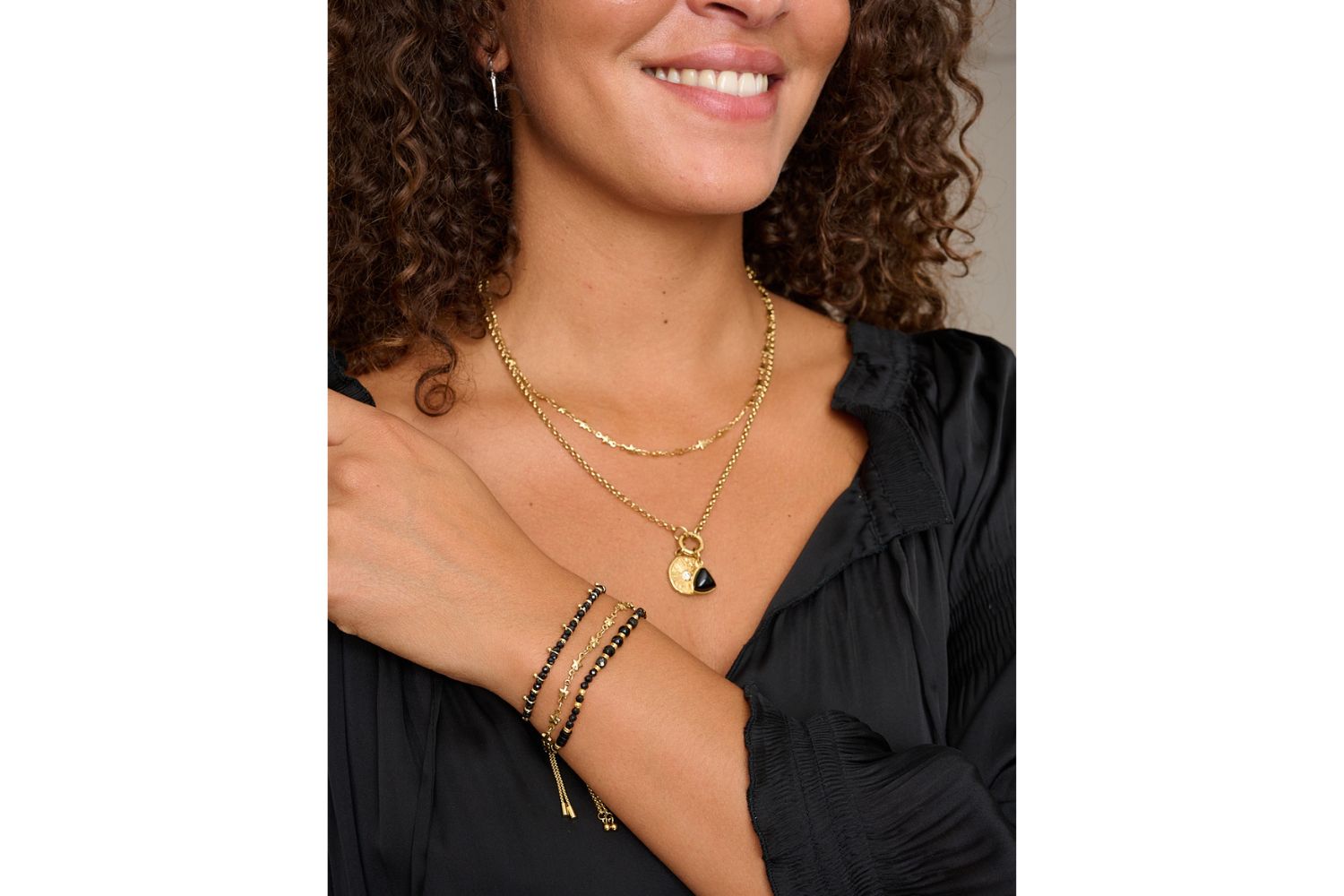 Alina & Solara gold star bracelet and necklace set layered with gold jewellery, styled on wrist and neckline – Boho Betty