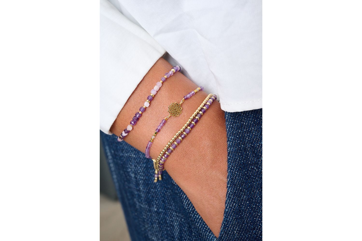 Violet Gold & Amethyst Mix Gemstone Bracelet featured on wrist with Boho Betty stacking bracelets in a boho chic setting