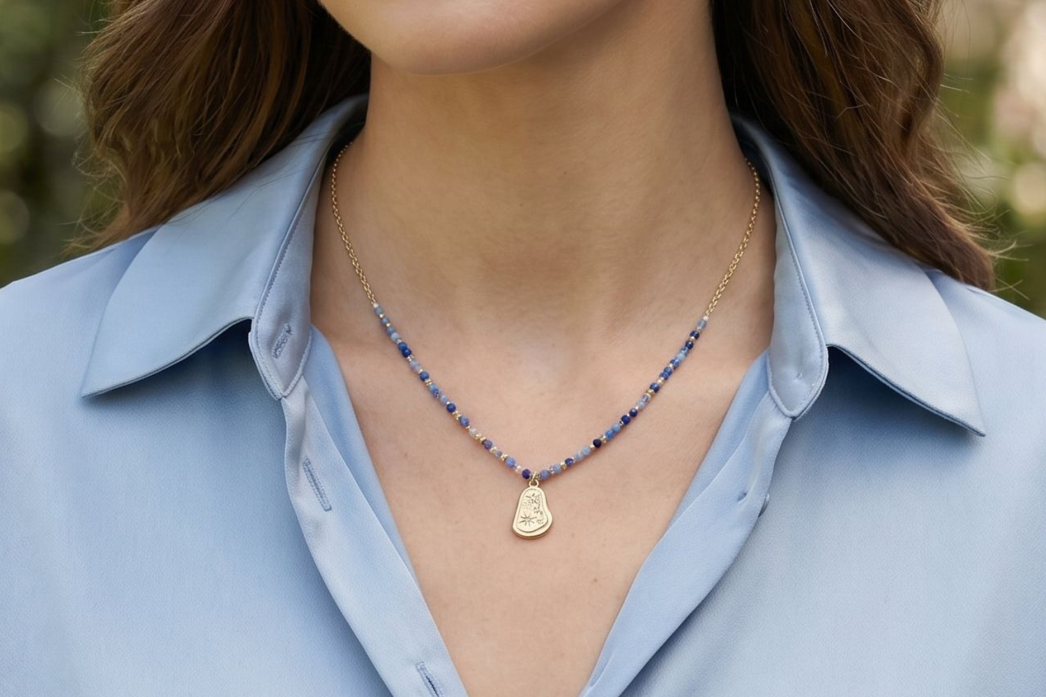 Armino blue aventurine beaded pendant necklace styled on the neckline, a soft blue gemstone necklace perfect for layering and everyday wear.