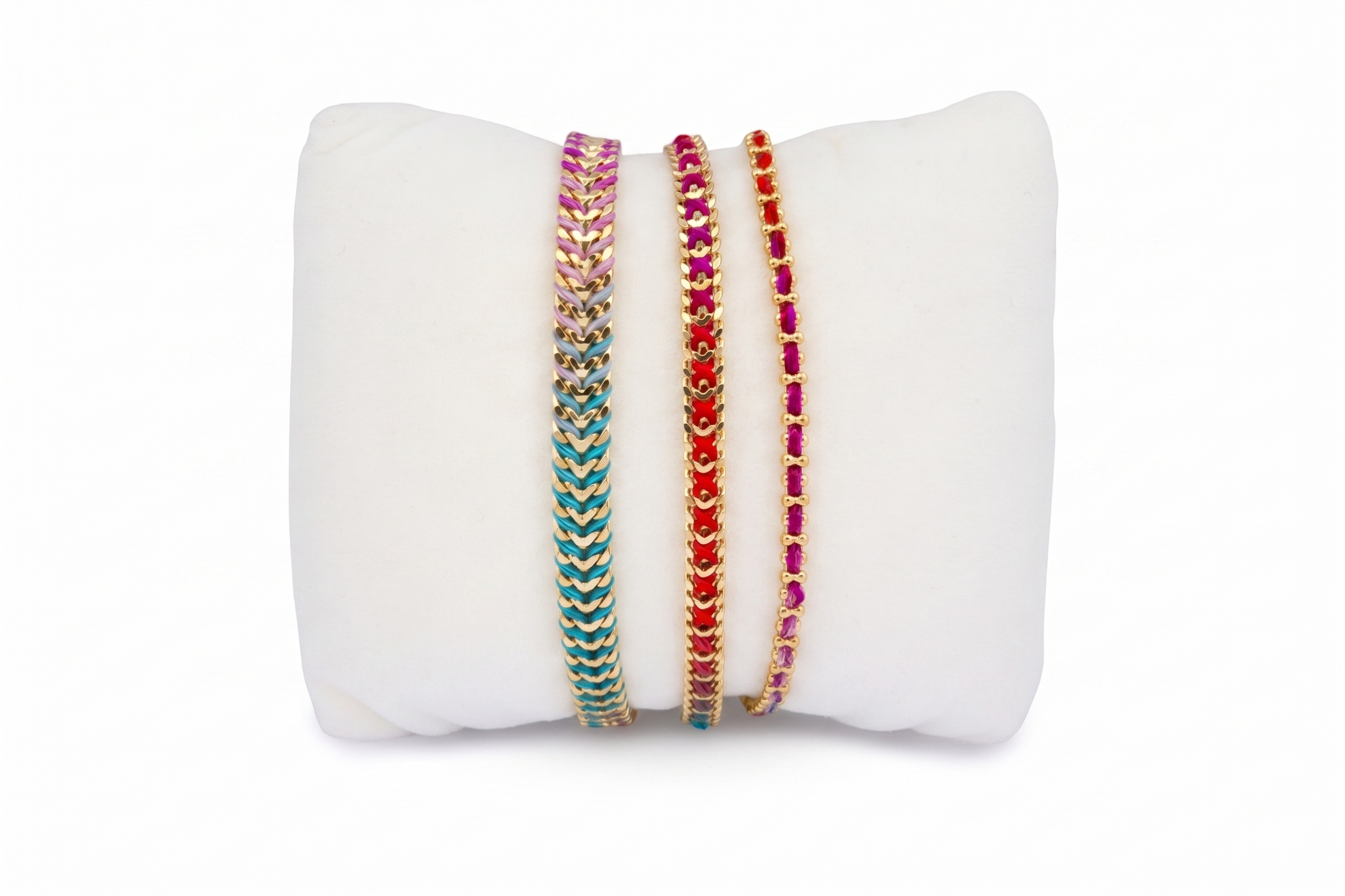 Banda Moroccan Spice Gold Bracelet Stack featuring three colourful woven bracelets with vibrant berry, orange, turquoise and pink tones finished with gold details.