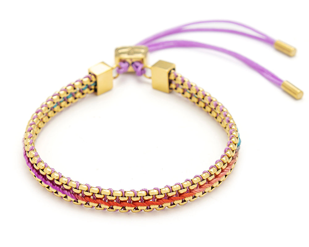 Bloom Moroccan spice braided friendship bracelet with warm berry, orange and pink threads and gold chain detailing with adjustable slider fastening.