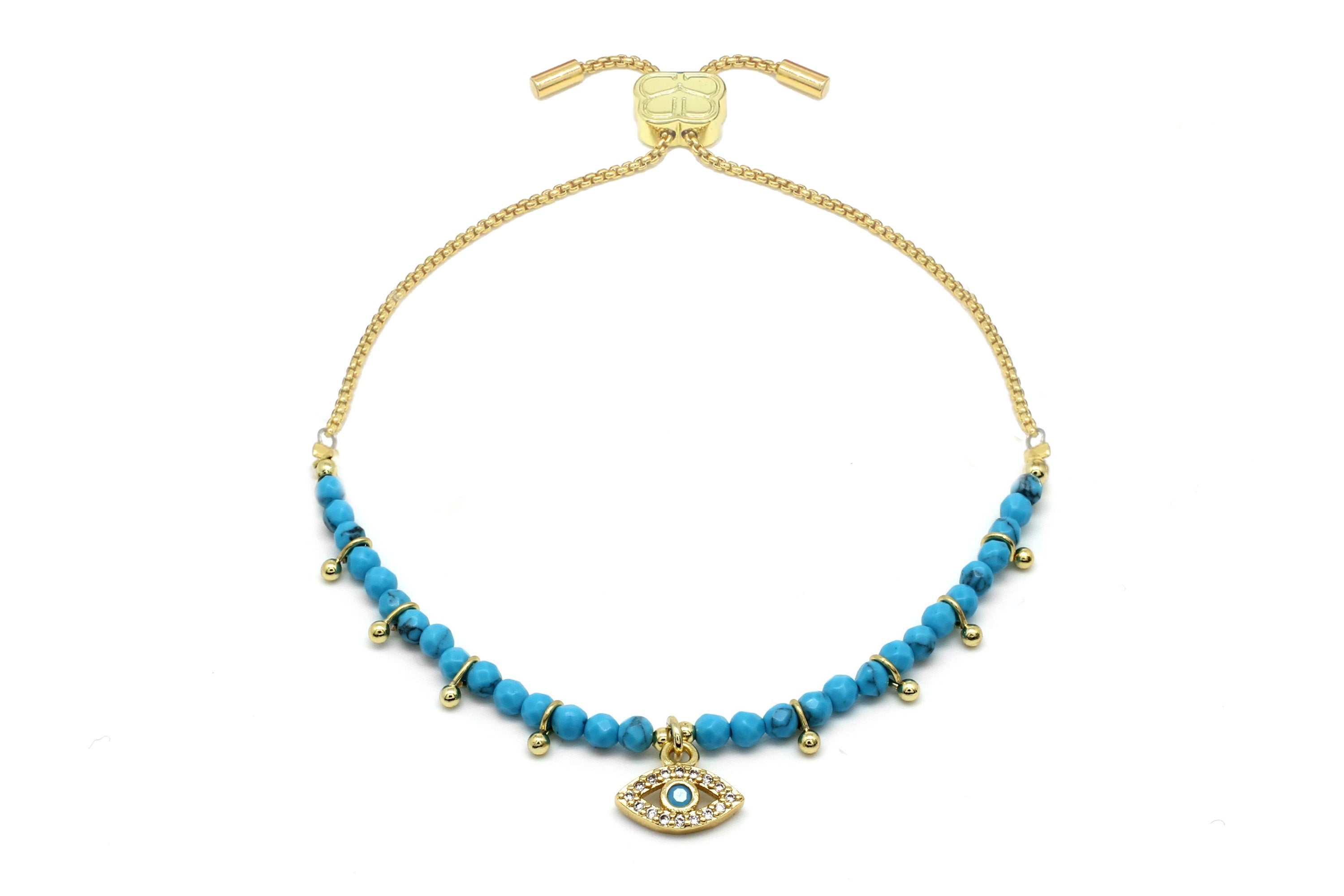 The Brela Turquoise Gold Bracelet with evil eye charm.