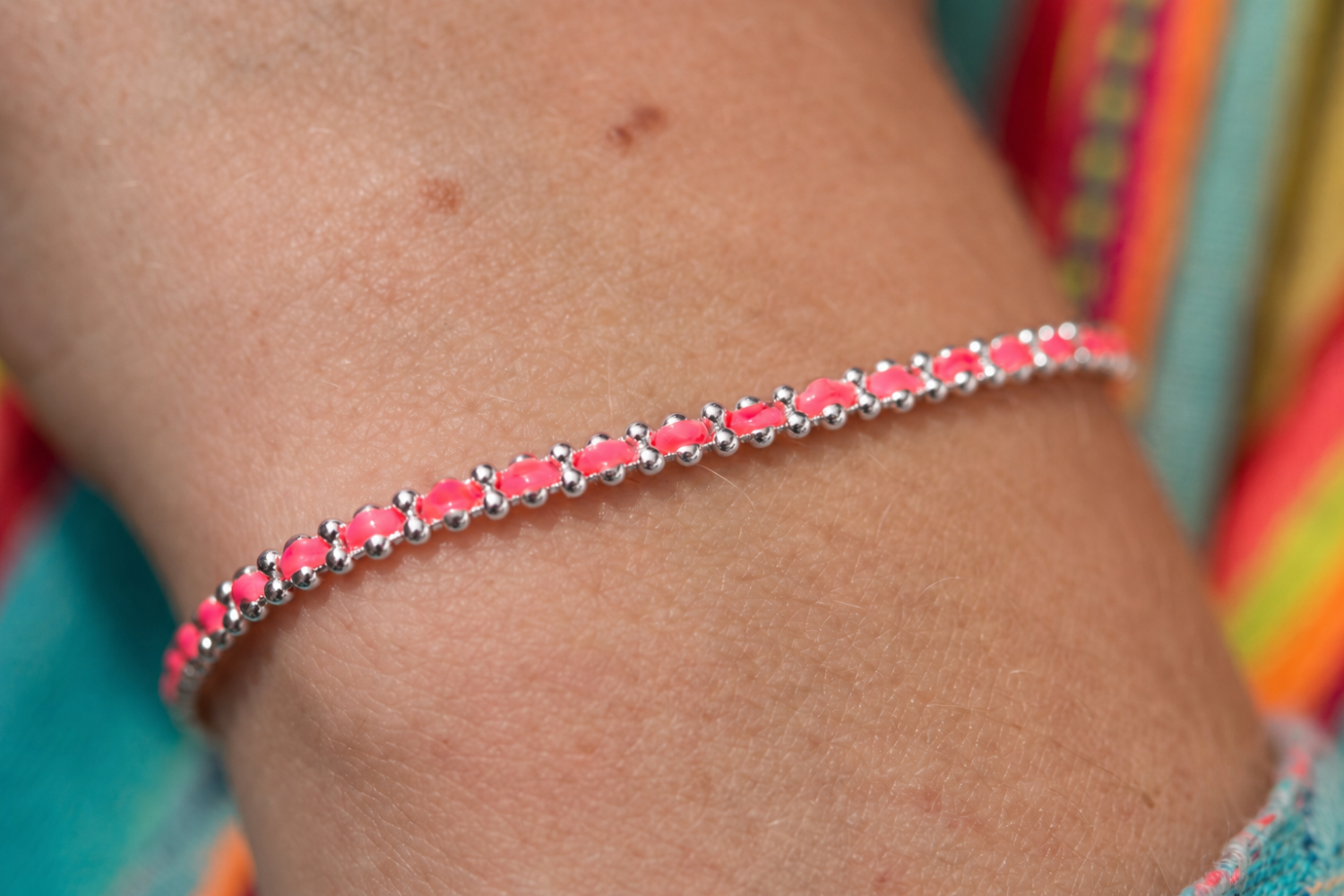 Braid Havana Brights Silver Woven Friendship Bracelet styled on the wrist, showcasing colourful woven threads and polished white gold PVD details.