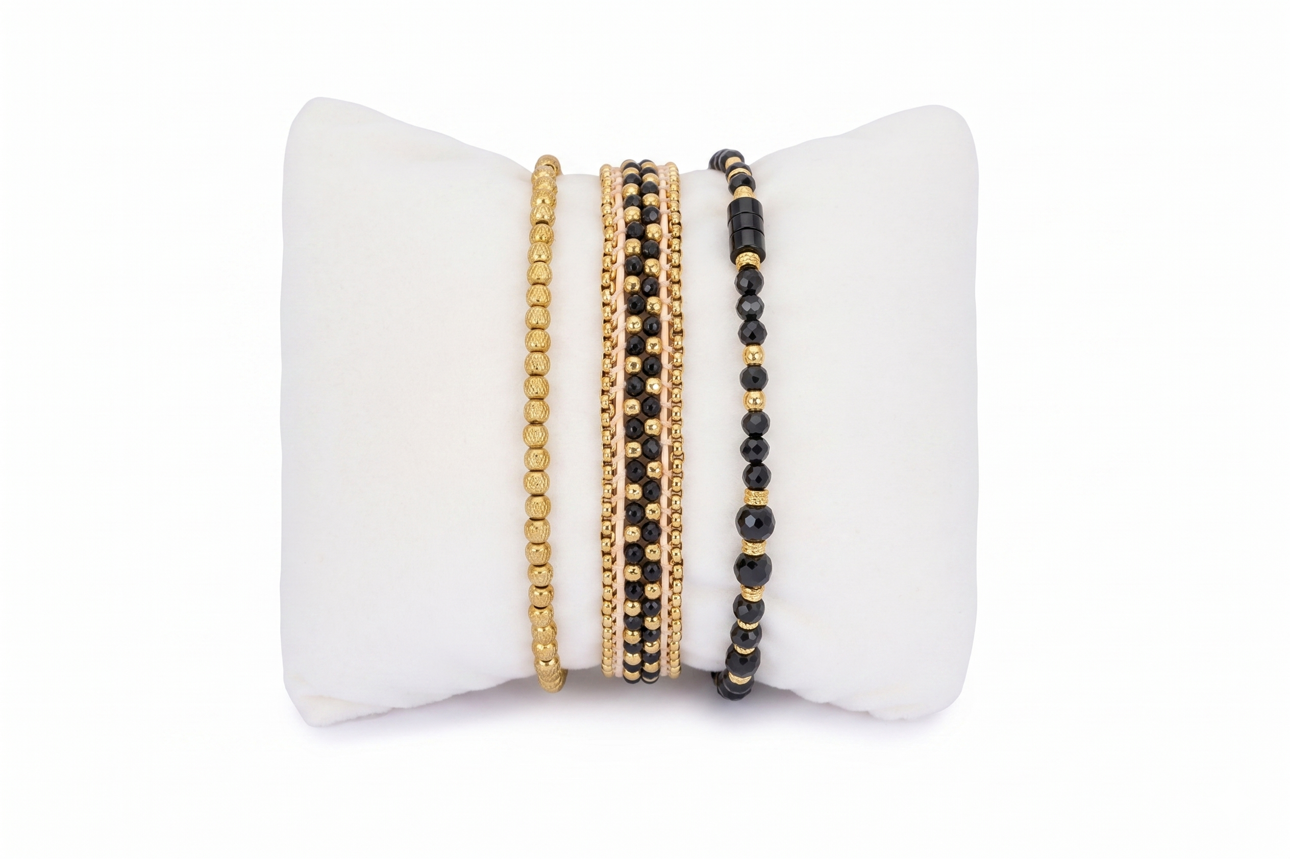Brava Black Spinel & Gold Bracelet Stack, trio of black gemstone and gold beaded bracelets layered together.