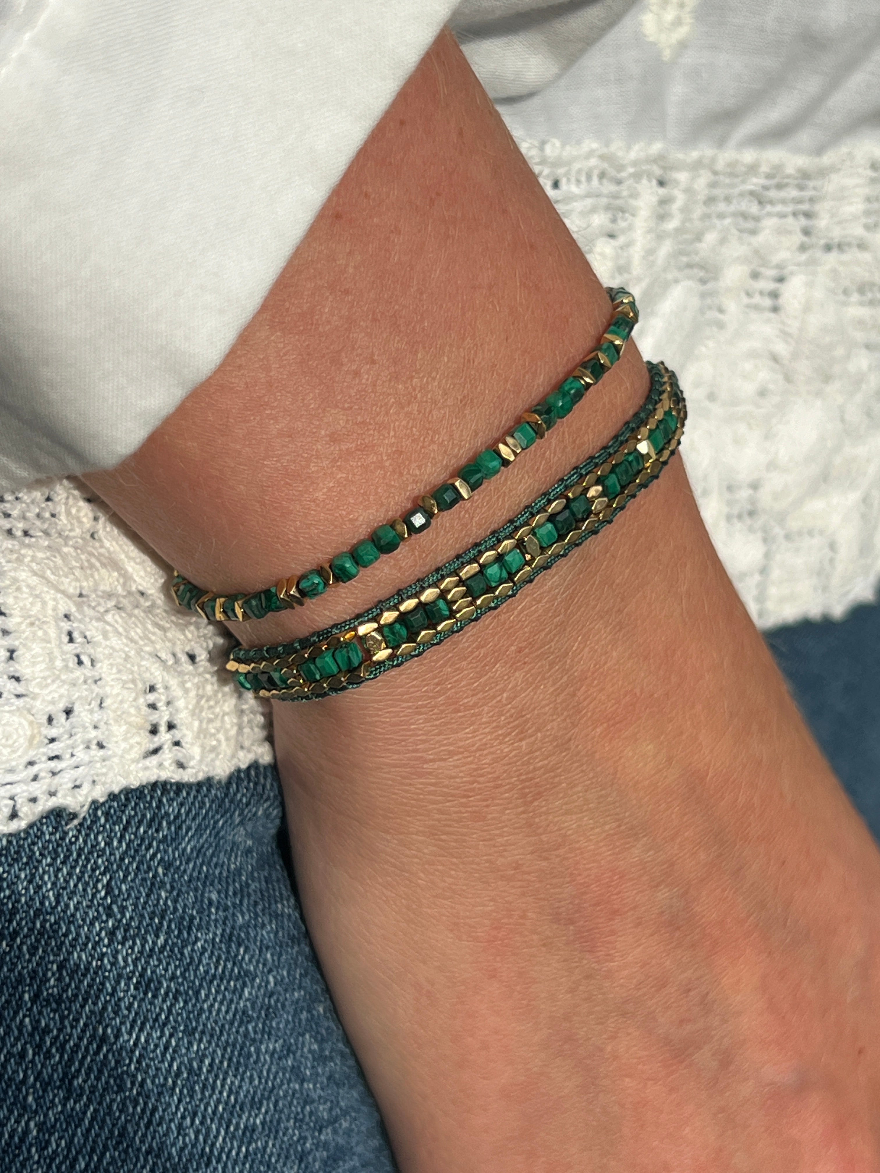 Celeste Malachite Gold Bracelet Stack styled for a meaningful everyday look, with lush green malachite gemstones and golden accents.