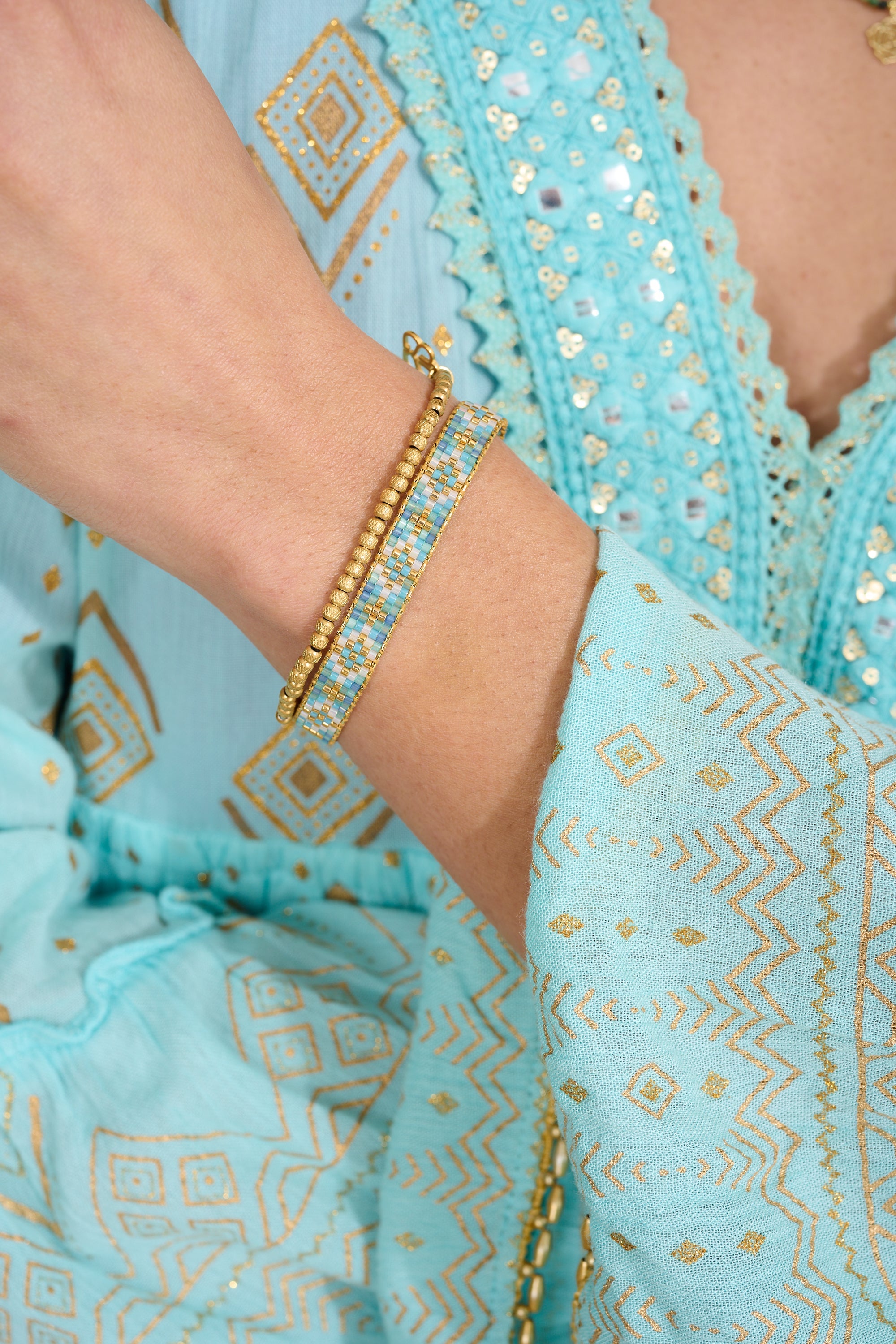 clara Gold Bead Stretch Bracelet styled for effortless layering, showcasing textured gold beads and Boho Betty’s iconic charm—perfect for oceanside brunches, sunset cocktails, and everyday elegance.