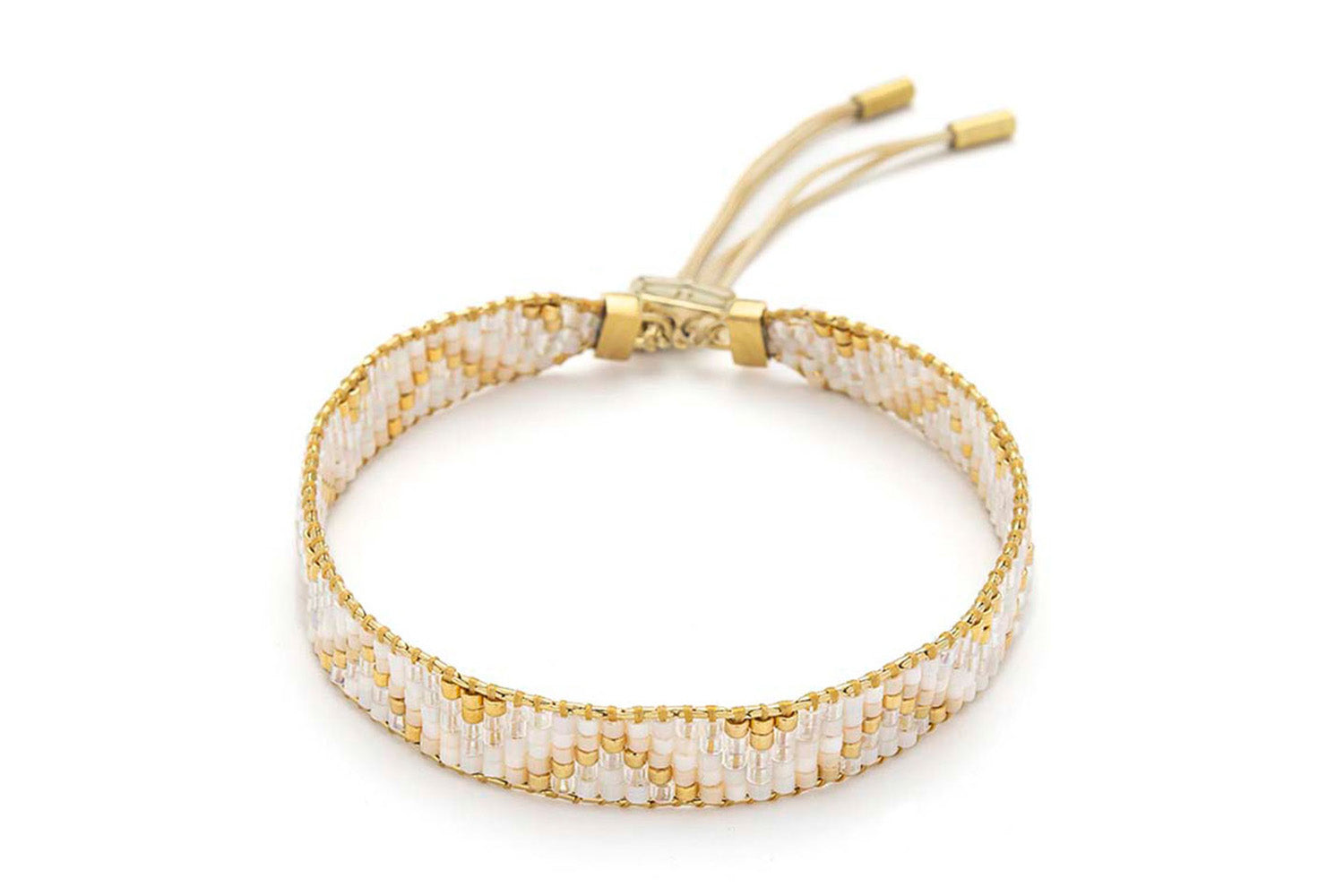 Claudia White Gold Friendship Bracelet featuring pearlescent Miyuki beads, soft vanilla tones, and 12k gold-plated accents with an adjustable slider fastening.