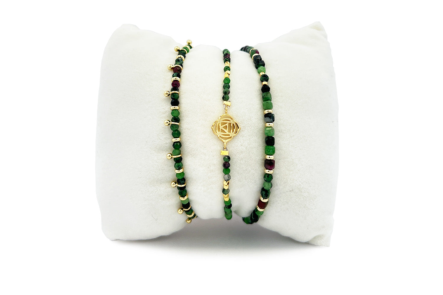 Coiba Gold & Ruby Zoisite Bracelet Stack with Violet cube-cut ruby zoisite stretch, Root Chakra strand with gold Muladhara charm, and Harmony slider with golden aura beads