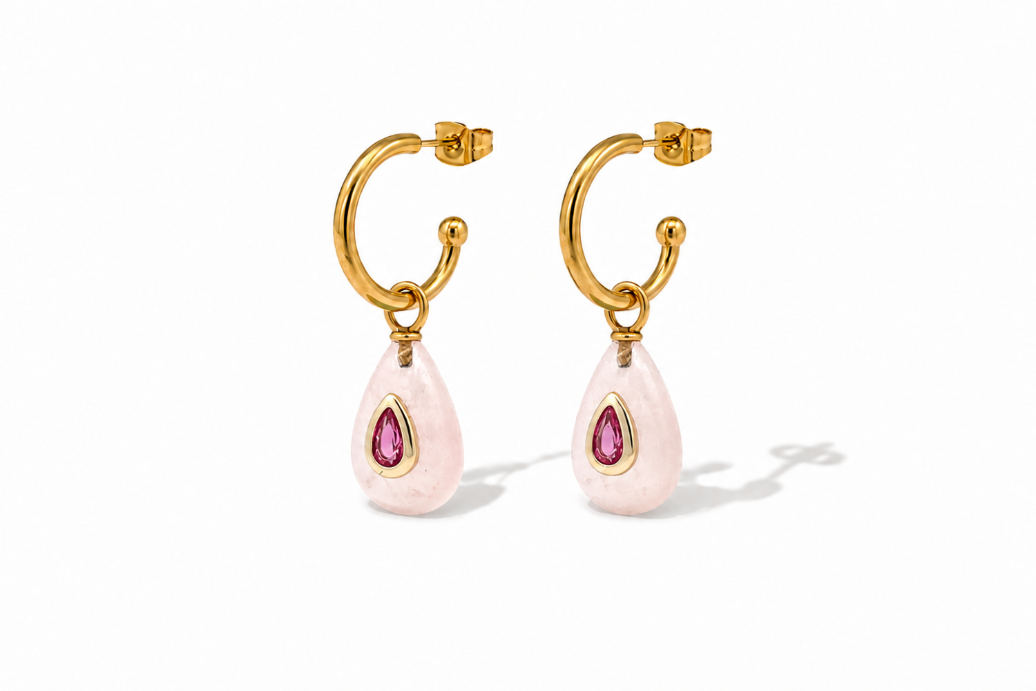 Hana Rose Quartz Gold Hoop Earrings featuring Rose Quartz gemstone drops with ruby-coloured crystal details on waterproof 14k gold PVD stainless steel hoops.