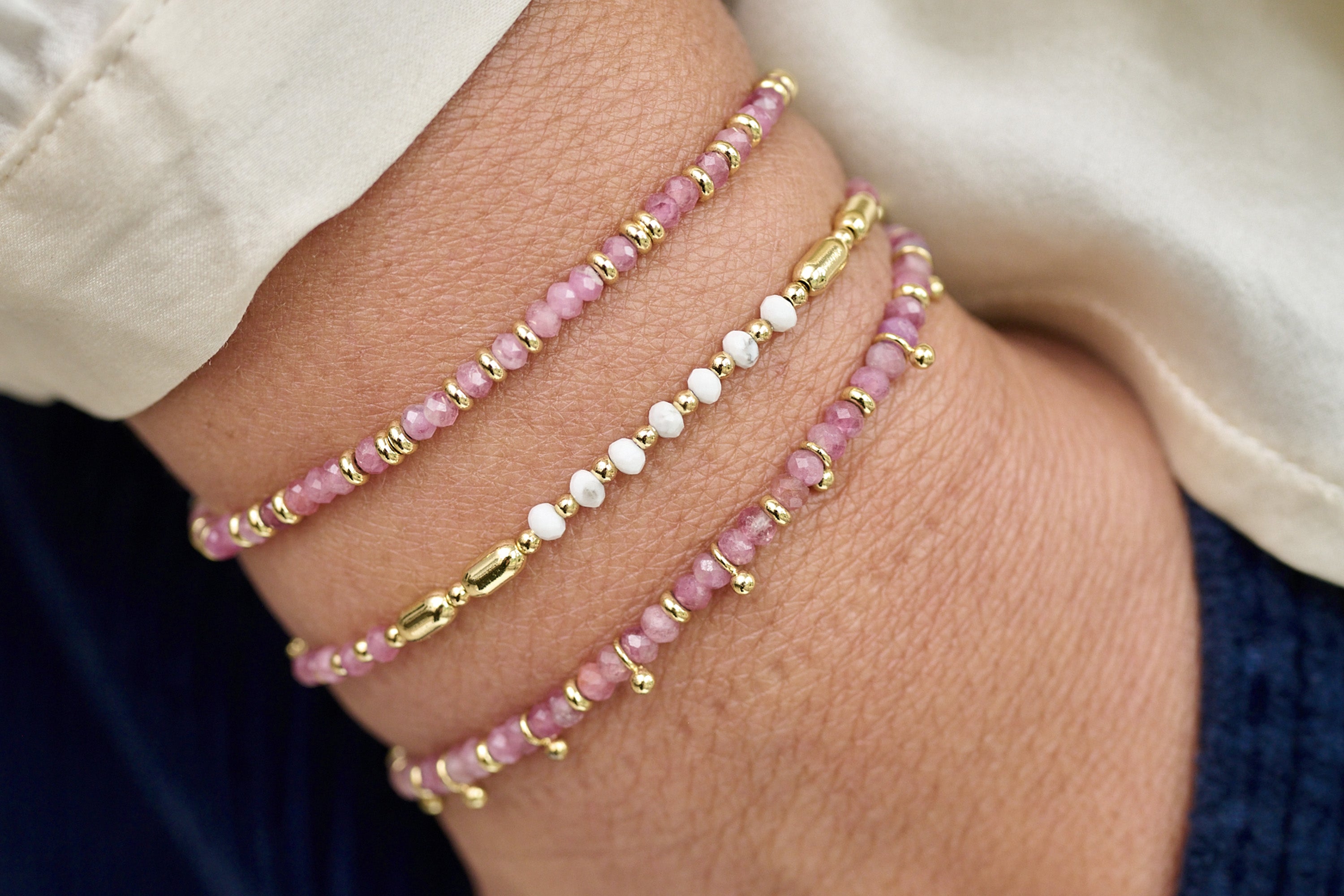 Harmony Pink Tourmaline Bracelet styled with warm gold jewellery for a soft, heart-led everyday look.