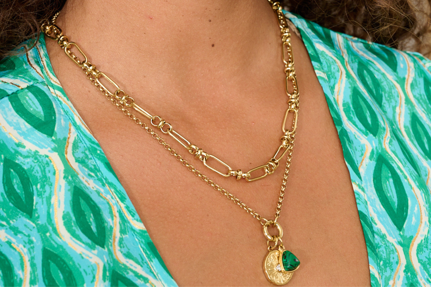 Helia necklace styled with beach-inspired gold layers, perfect for summer and everyday wear.