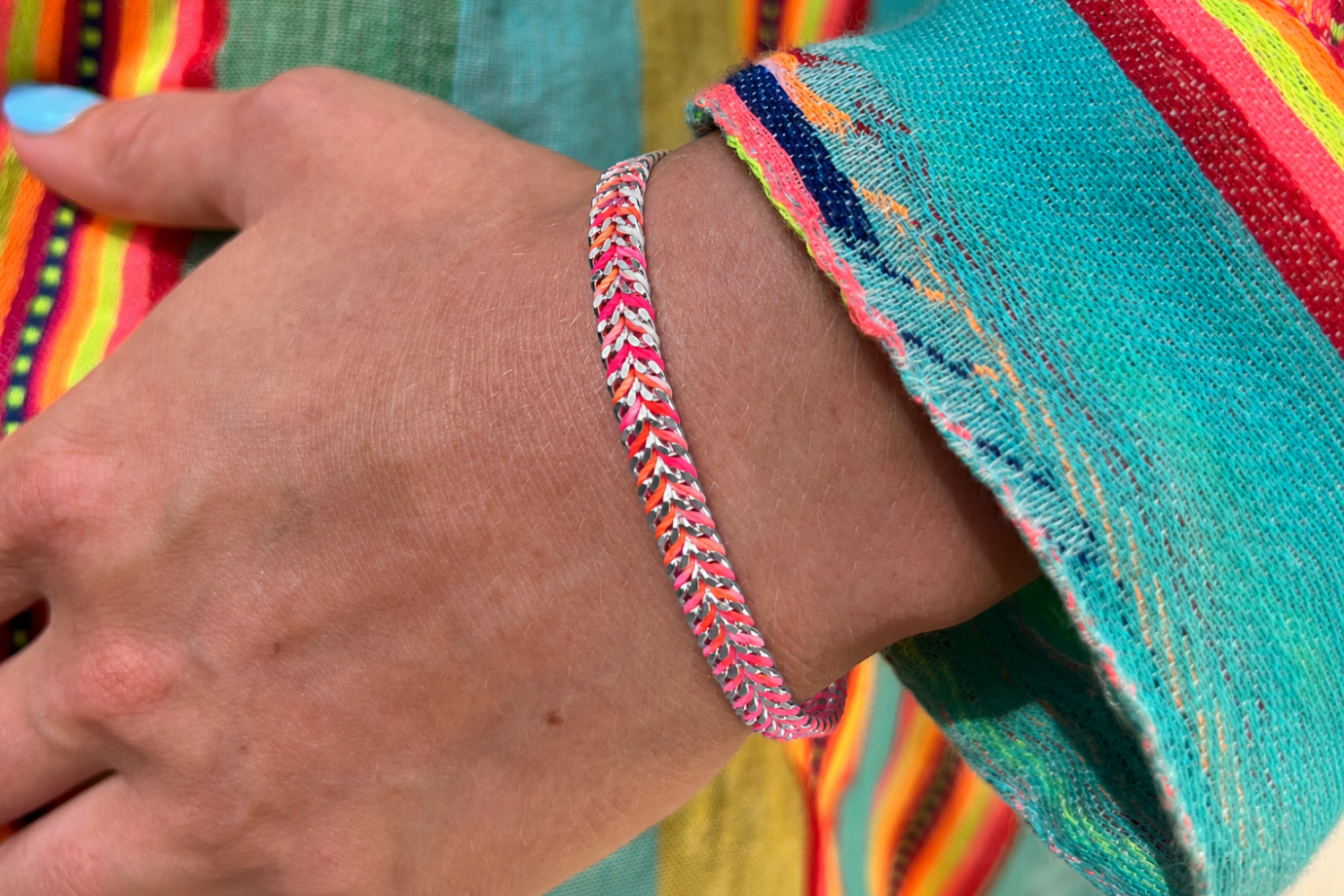 Iztac Havana Brights Silver Braided Bracelet styled on the wrist, showcasing colourful woven threads and polished silver PVD details for effortless boho layering.