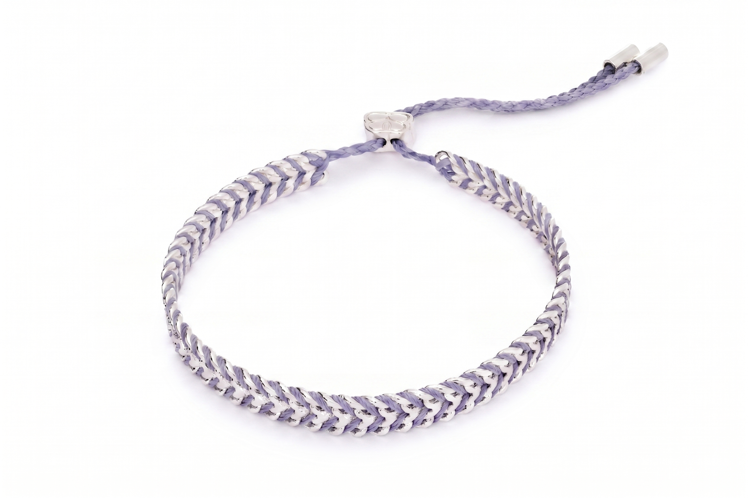 Iztac Lilac Silver Woven Bracelet featuring soft lilac braided thread woven through a polished silver chain with an adjustable slider fastening.