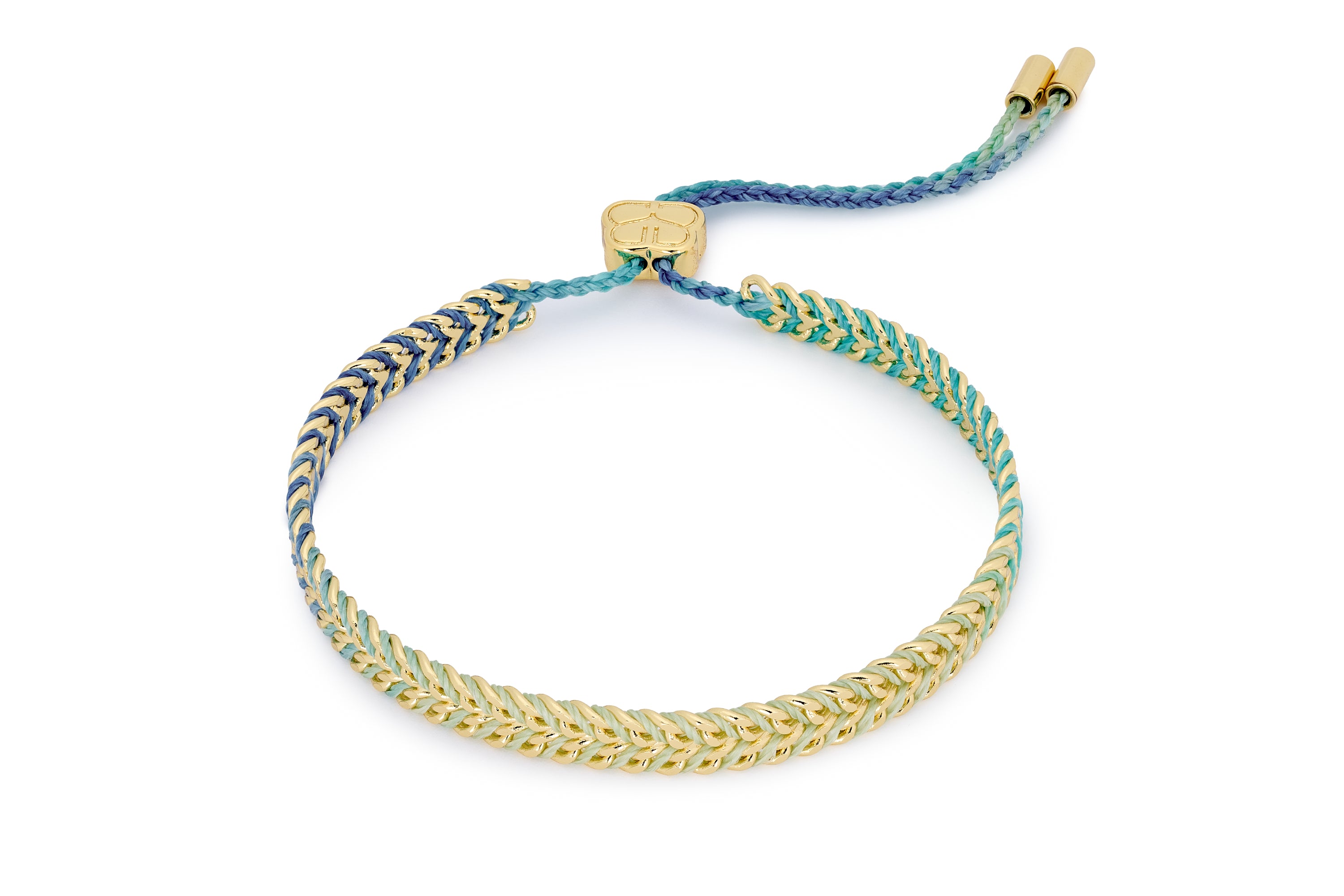 Iztac SKY Gold & Blue Ombre Braided Bracelet styled on the wrist, blue ombré woven threads with polished gold chain accents.