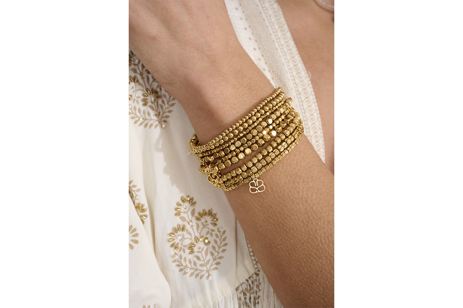 Kamini Gold Bracelet Set styled in a layered wrist stack, showcasing the delicate 3mm and 4mm gold beads for a minimalist yet elegant look.
