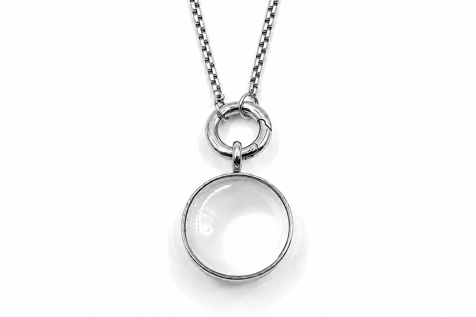 Leilani midi silver locket necklace with glass front designed to hold gemstone chips and letter charms on a polished silver chain.