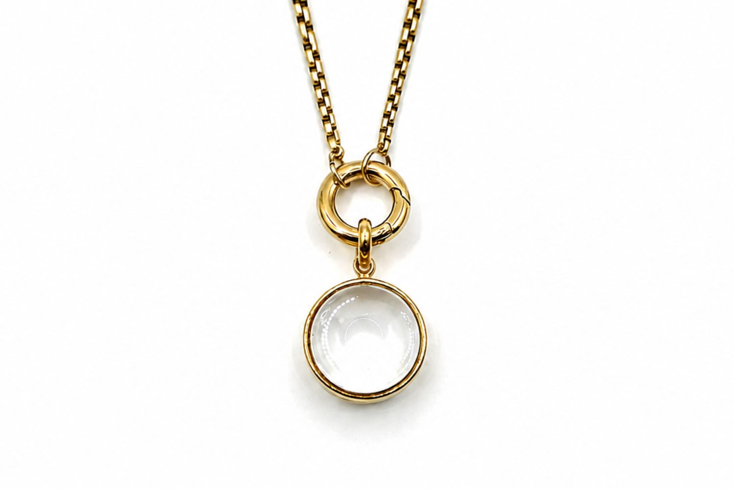 Leilani mini gold locket necklace with glass front designed to hold gemstone chips and letter charms on a gold chain.