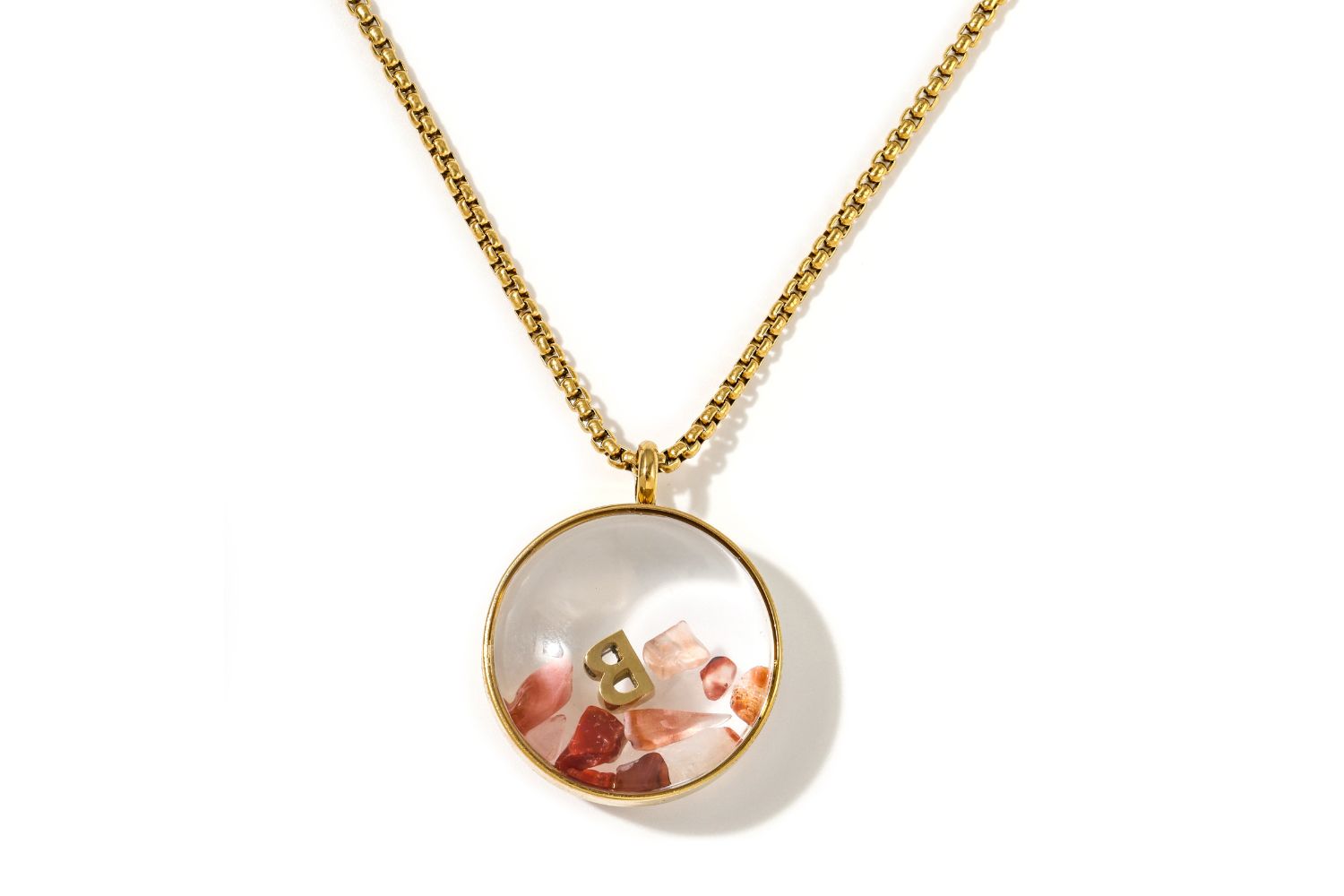Leilani Personalised Gold Locket Necklace featuring Carnelian chips and an engraved initial charm inside a glass fillable pendant on a gold chain.