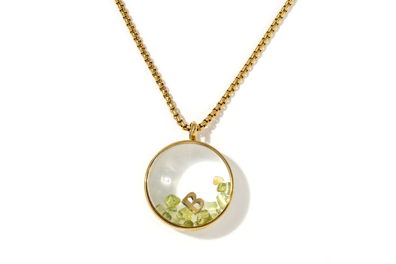 Leilani Personalised Gold Locket Necklace featuring Peridot chips and an engraved initial charm inside a glass fillable pendant on a gold chain.
