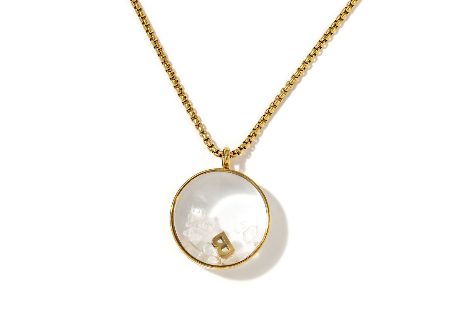 Leilani Personalised Gold Locket Necklace featuring Rock Crystal chips and an engraved initial charm inside a glass fillable pendant on a gold chain.