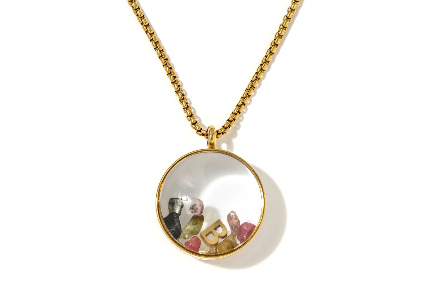 Leilani Personalised Gold Locket Necklace featuring Tourmaline chips and an engraved initial charm inside a glass fillable pendant on a gold chain.