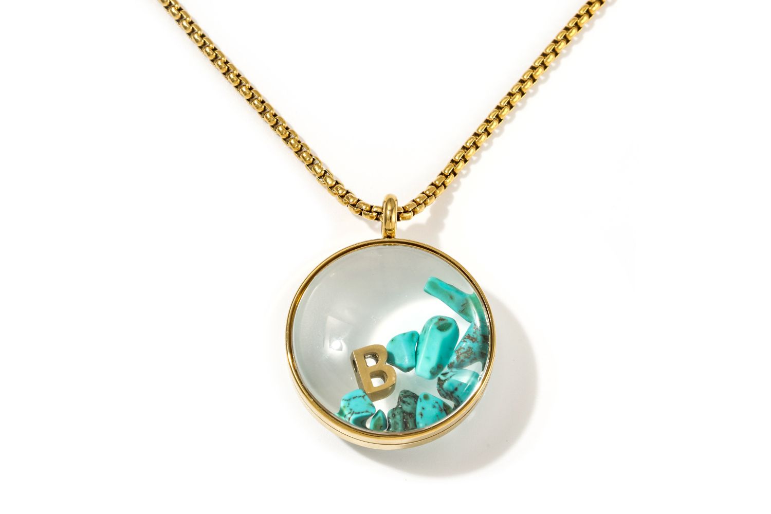 Leilani Personalised Gold Locket Necklace featuring Turquoise Howlite chips and an engraved initial charm inside a glass fillable pendant on a gold chain.