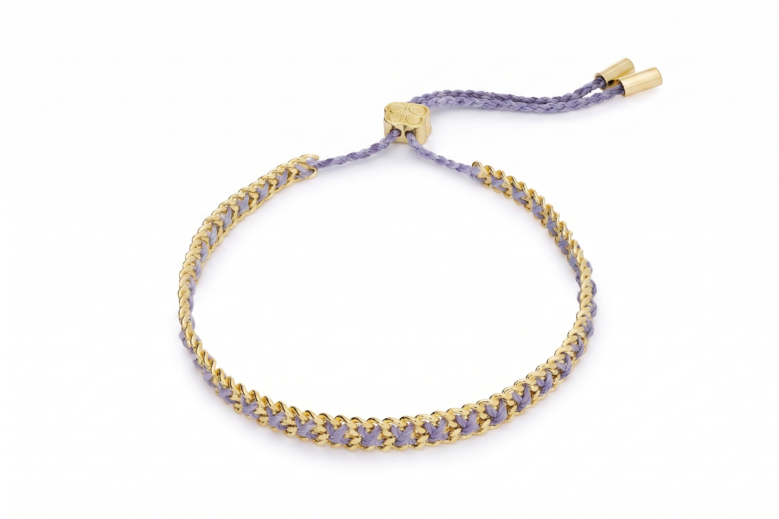 Lilia Lilac Gold Woven Bracelet featuring soft lilac braided thread woven through a polished gold chain with an adjustable slider fastening.