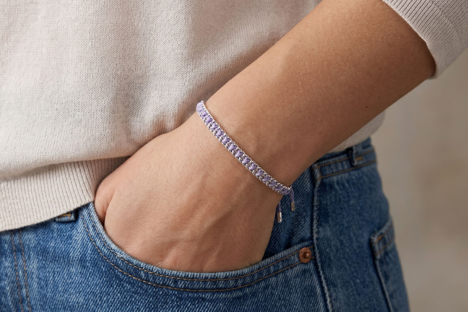Lilia Lilac Silver Woven Bracelet styled on the wrist, showcasing soft lilac woven detailing and polished silver accents for relaxed boho styling.