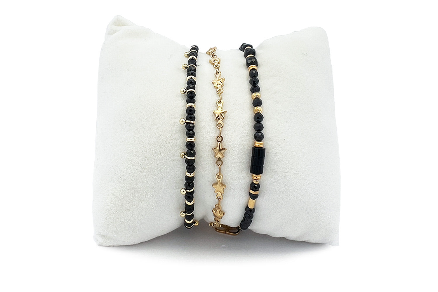 Majuro black spinel gold bracelet stack, black gemstone and gold beaded bracelets with star motifs and adjustable slider fits