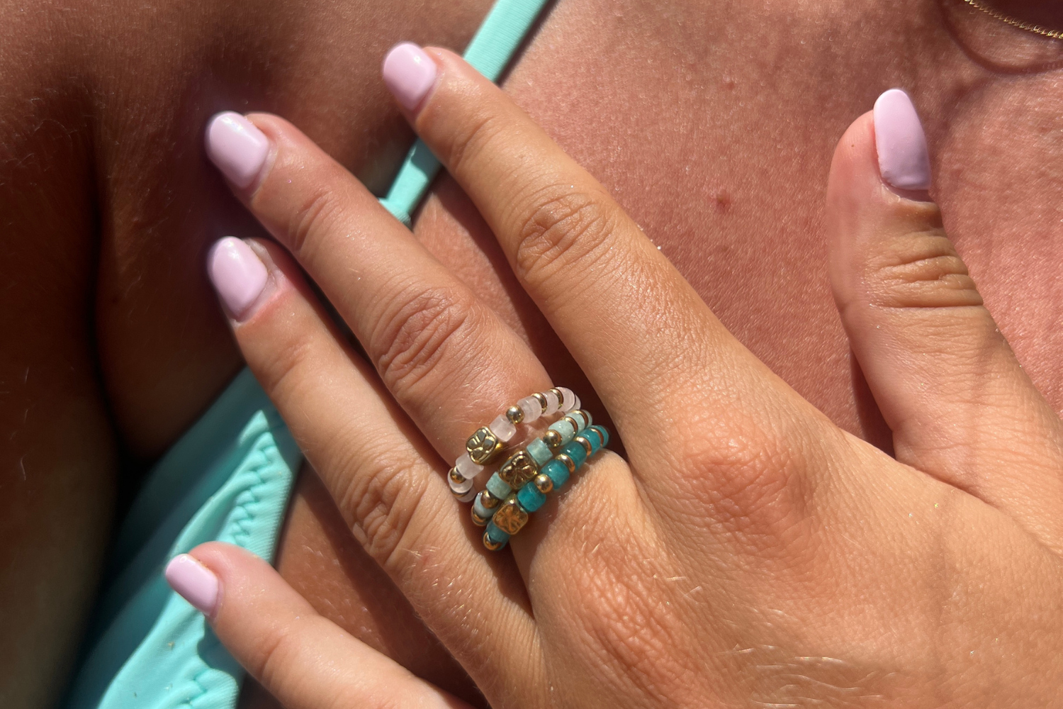 Mala Bright Amazonite Gold Waterproof Stretch Ring worn stacked with bright cube-cut Amazonite gemstone beads and waterproof 14k Gold PVD stainless steel details.