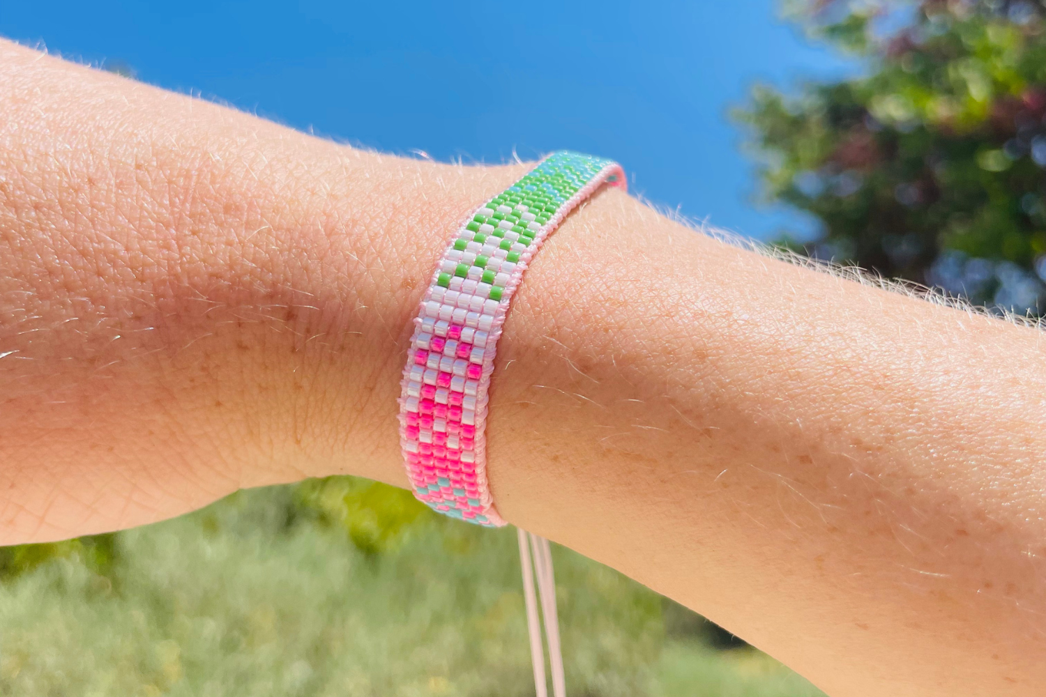 Maranta Pink & Green Gold Waterproof Beaded Friendship Bracelet worn stacked with colourful Japanese Miyuki glass beads, pink thread and waterproof 14k Gold PVD stainless steel details.