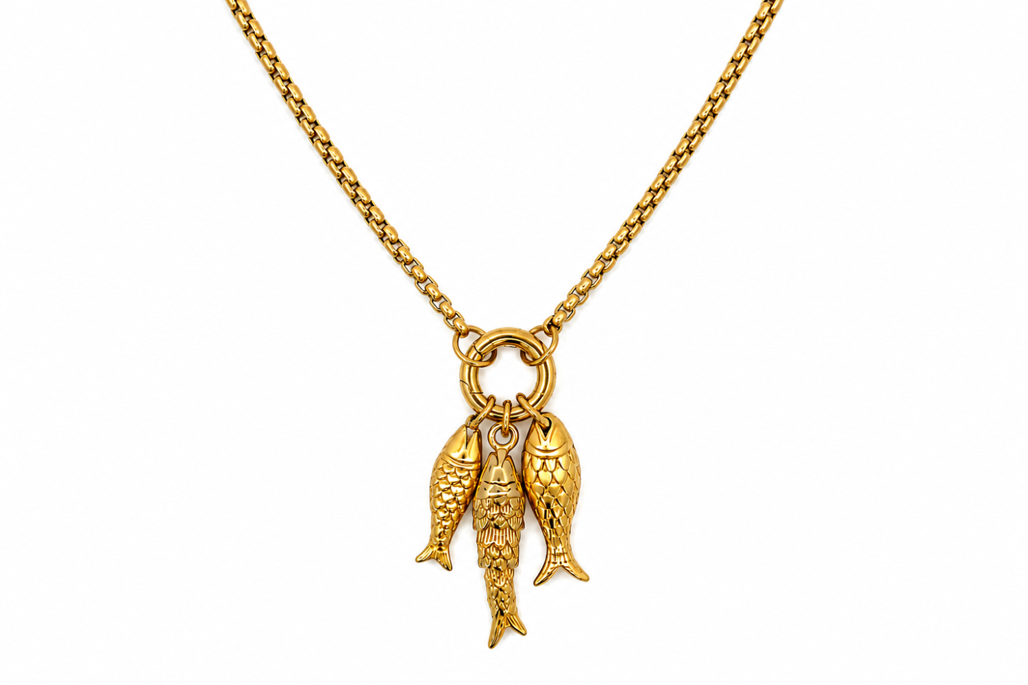 Maris Gold Fish Charm Necklace worn as a statement necklace, featuring three textured golden fish pendants suspended from a chunky round charm carrier.