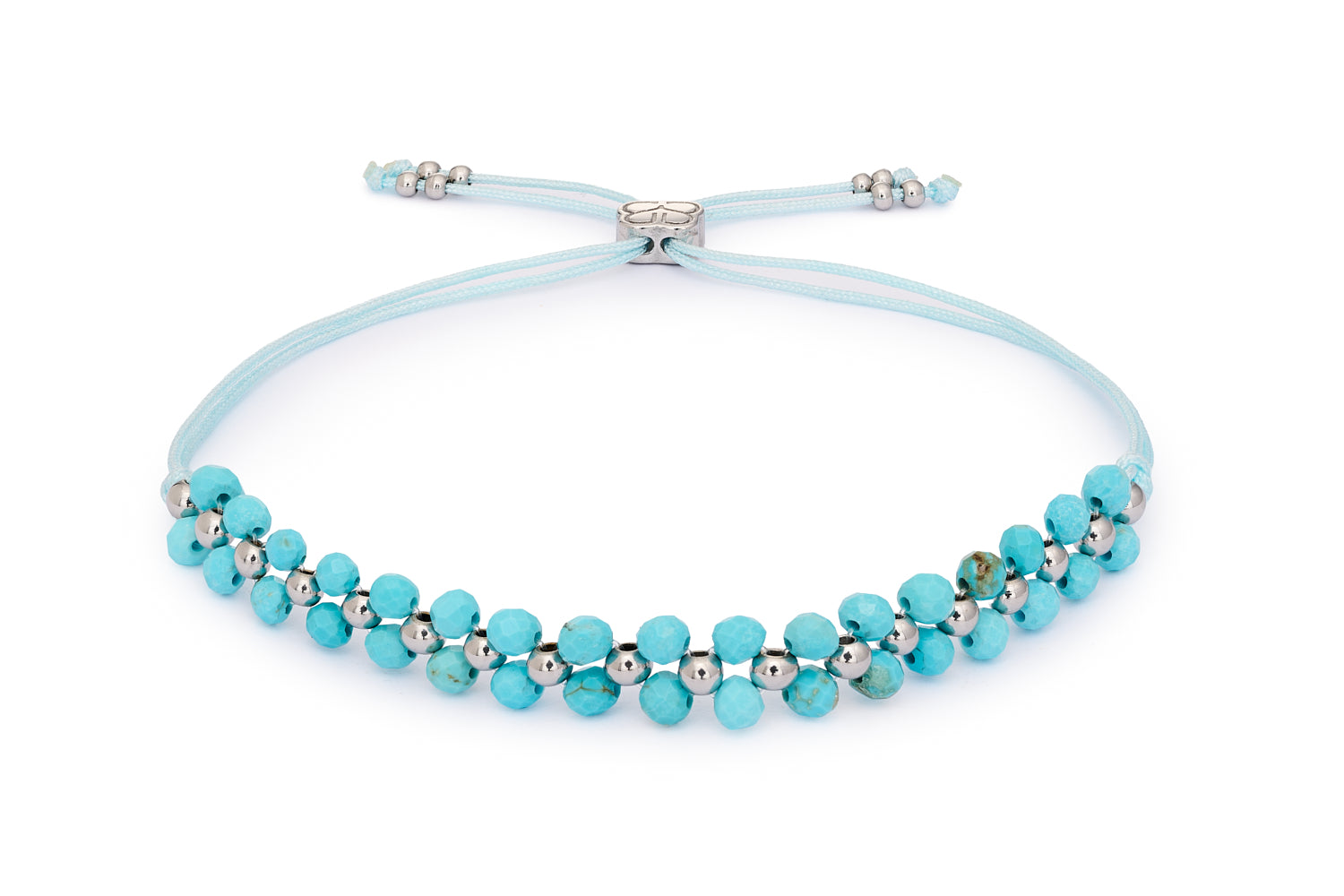 Marisol Turquoise Howlite & Silver Gemstone Bracelet featuring faceted turquoise howlite gemstones with stainless steel silver-plated accents and adjustable woven slider fit up to 26cm.