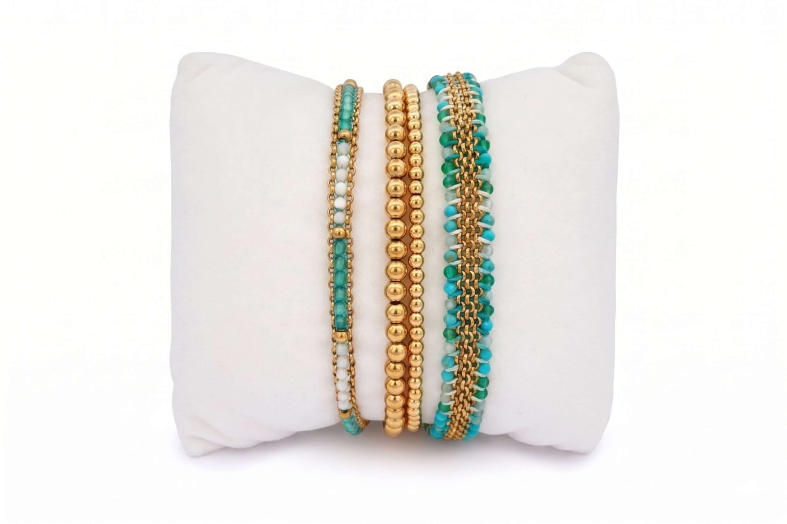 Martinique Turquoise and Gold Bracelet Stack featuring layered turquoise gemstone bracelets, gold bead details and woven friendship bracelet textures in a bright boho-inspired design.