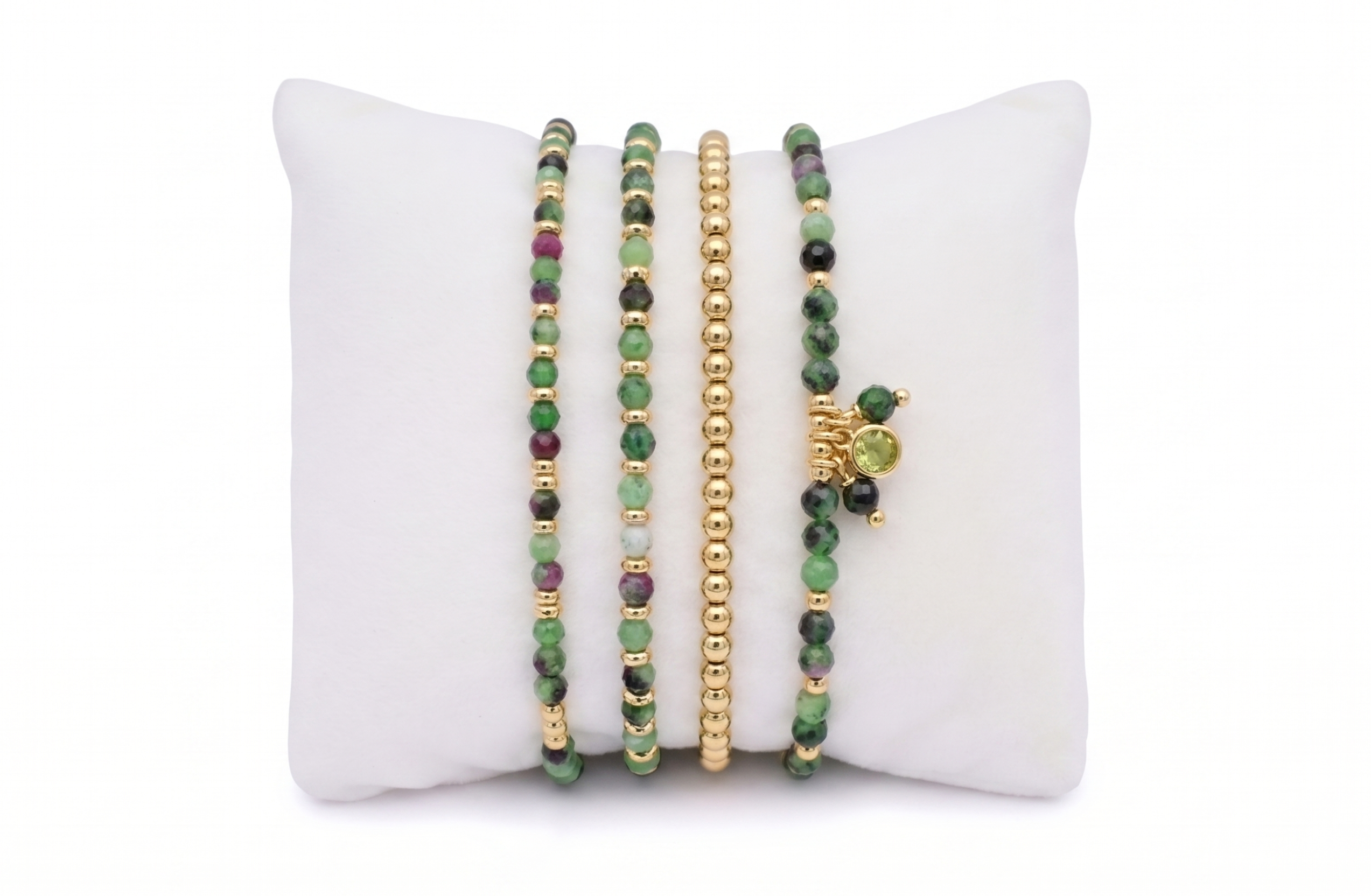 Matina Ruby Zoisite Gold & Green Bracelet Stack with four strands: double-wrap ruby zoisite, fine slider and green-cord charm bracelet with gold accents
