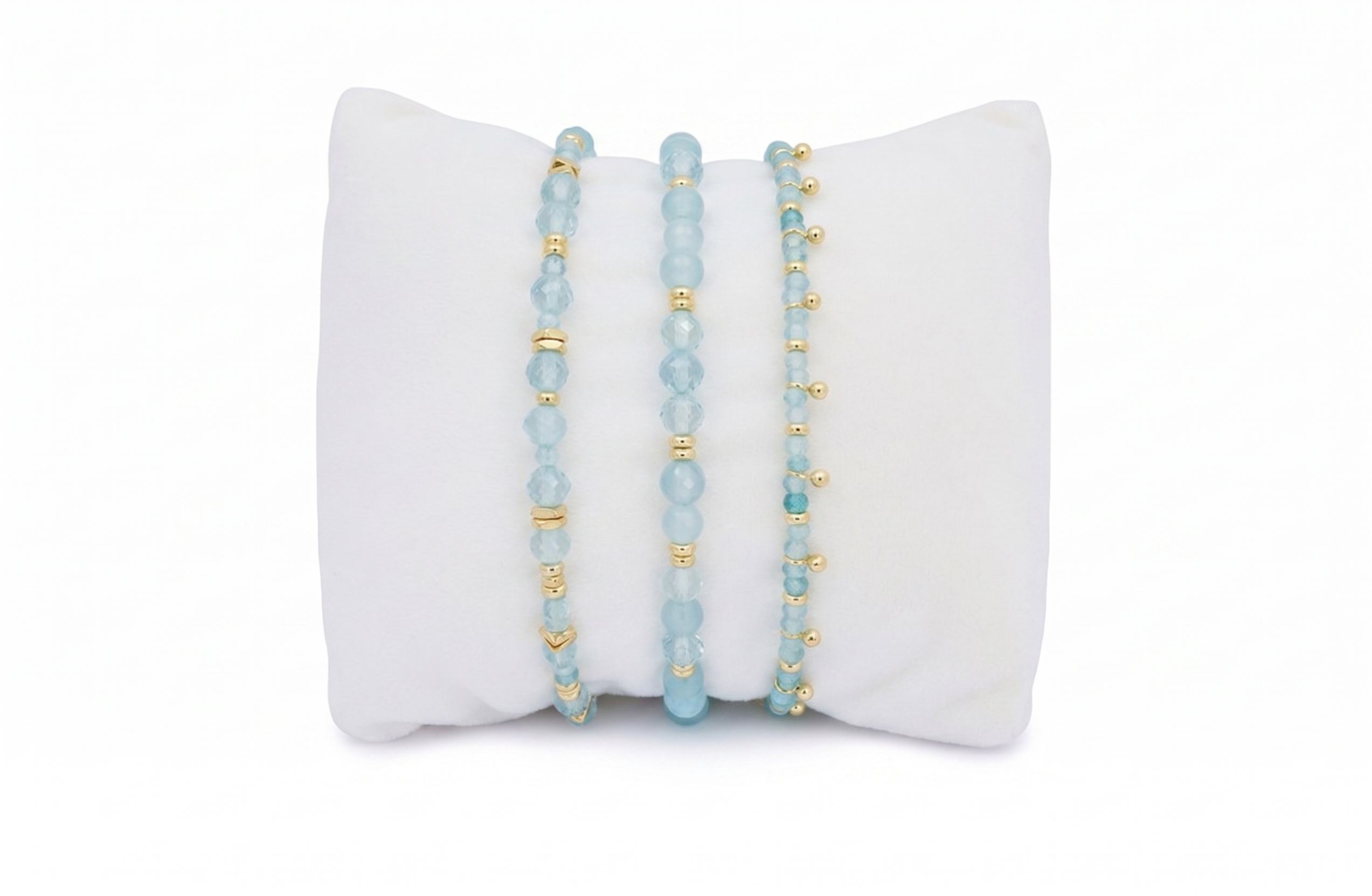 Moala blue topaz gold bracelet stack, faceted blue topaz gemstone bracelets with polished gold accents and adjustable slider fits