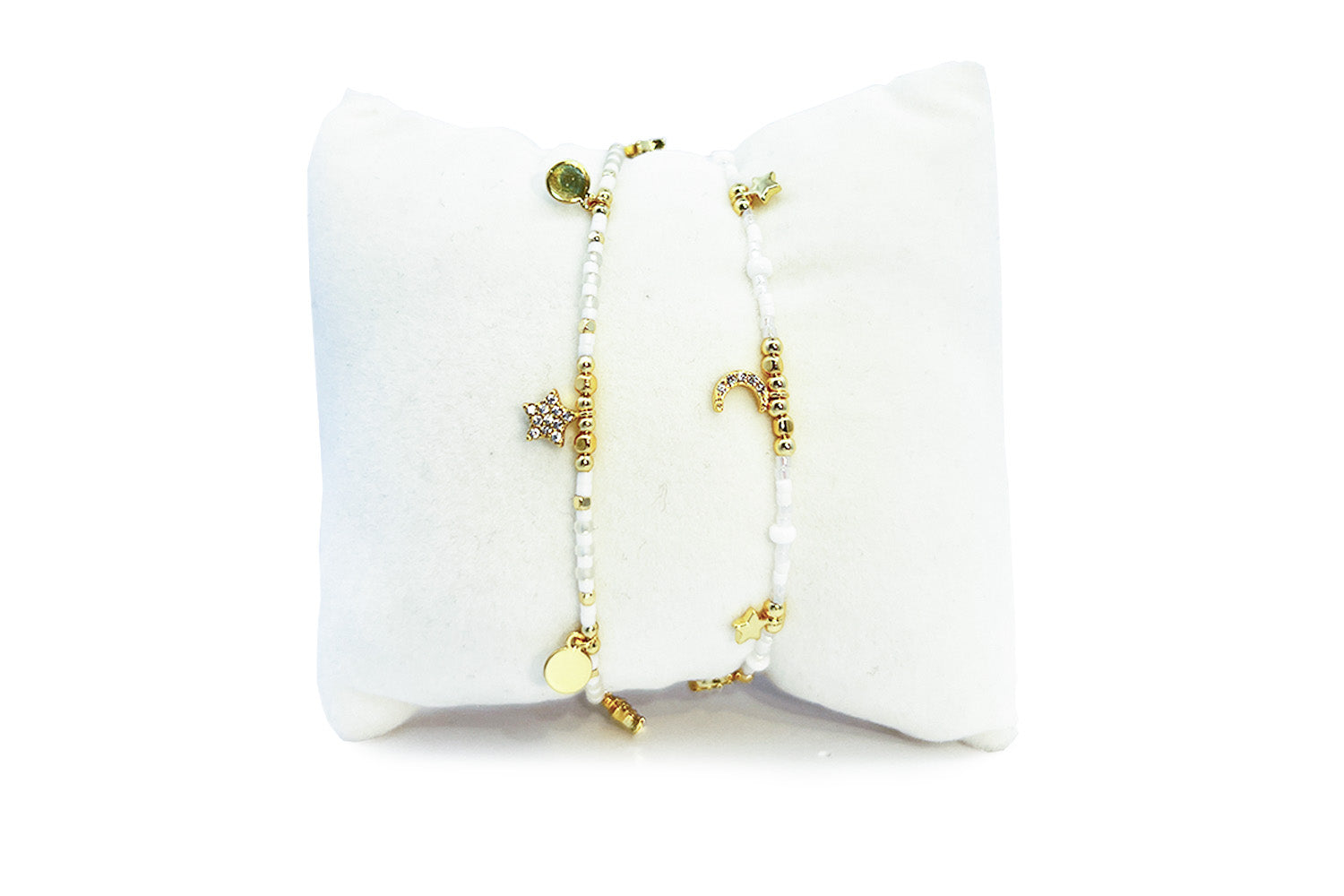 Mondesi White & Gold Stacking Bracelets, ivory Miyuki beads with gold moon and star charms in an adjustable duo.