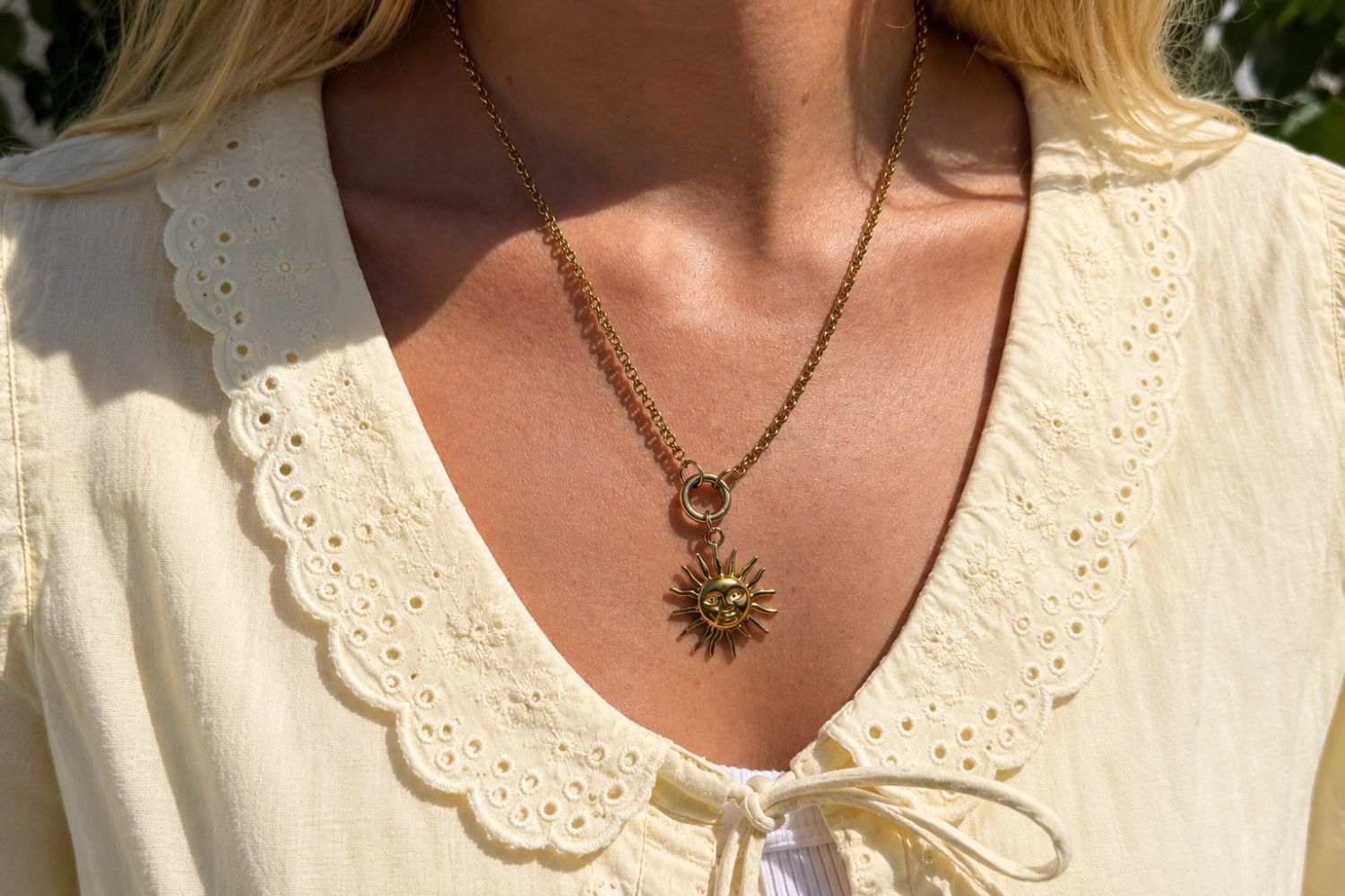 Waterproof Sun Charm Gold styled on a Boho Betty charm carrier necklace with collectable charms, showcasing a sculptural smiling sun pendant in waterproof 14k gold PVD stainless steel.
